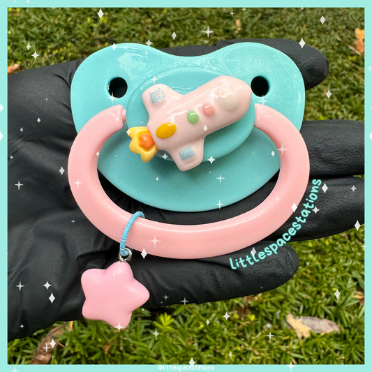 pink spaceship adult pacifier